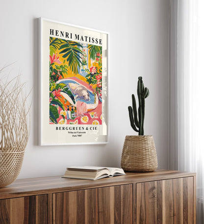 Framed colorful manatee bath wall art print in Henri Matisse inspired style with lush greenery, flowers, and warm sunlight - decorative bathroom print for wall decor