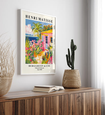 Coastal framed art print featuring seaside bungalow, palm tree, and flowers