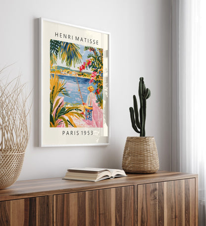 Coastal framed art print of fisherman with fishing pole near village by water