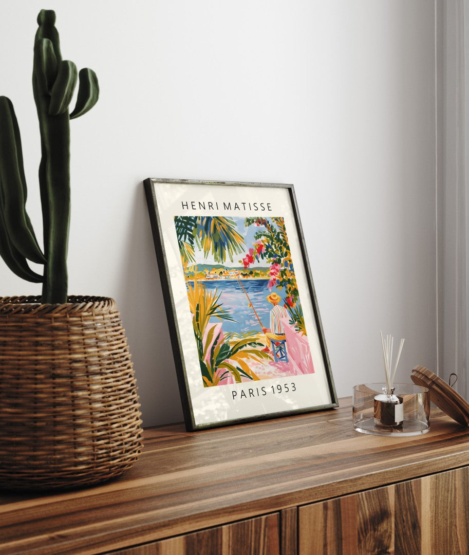 Framed art print featuring fisherman by seaside with flowers and bold Matisse colors