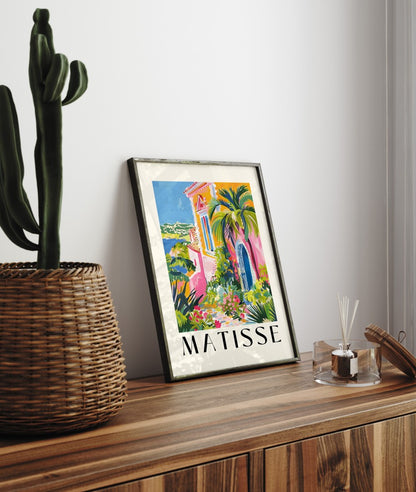 Framed seaside art print of Mediterranean villa surrounded by lush garden in Matisse style