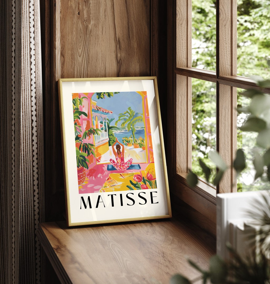 Framed art print showing woman doing yoga on terrace with ocean view