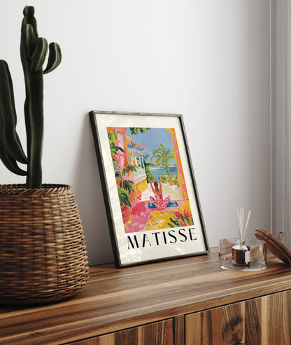 Framed art print of woman practicing yoga with Mediterranean coastal scenery in Matisse colors