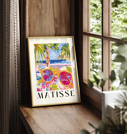 Framed art print showing sunglasses reflecting palm trees and ocean waves