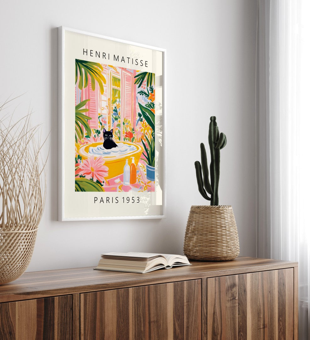 Bright wall art featuring a black cat in a bathtub with tropical leaves and flowers.