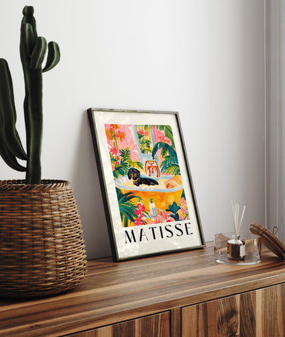 Framed artwork of a dachshund in a bright, plant-filled bathroom.
