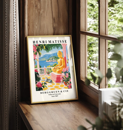 Buddha coastal art print in Matisse style. A colorful seaside artwork with statue, flowers, cat, and ocean view.